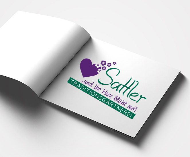 Ein Buch zeigt das Logo des Kunden Traditionsgärtnerei Sattler, welches von der Werbeagentur Werbereich OG erstellt wurde.