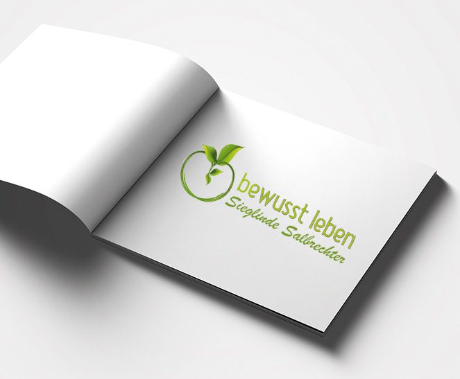 Ein Buch zeigt das Logo des Kunden Sieglinde Salbrechter, welches von der Werbeagentur Werbereich OG erstellt wurde.